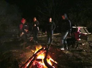 Church members gathered around the bonfire