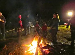 Families warming up by the bonfire