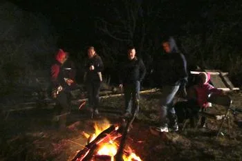 Church families around a bonfire at night