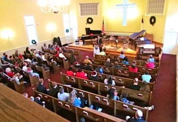 The congregation gathered in the sanctuary for worship